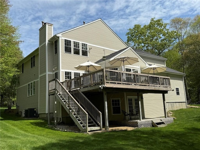 36 Jasmine Cir, North Kingstown, RI 02874 - back of property with a chimney, a wooden deck, central AC, and a lawn