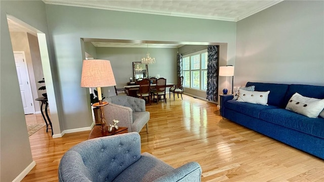 36 Jasmine Cir, North Kingstown, RI 02874 - living room with a chandelier, light wood-type flooring, ornamental molding, and baseboards