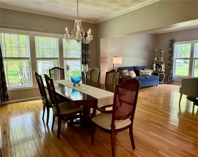 36 Jasmine Cir, North Kingstown, RI 02874 - dining space with a chandelier, light wood finished floors, ornamental molding, and baseboards