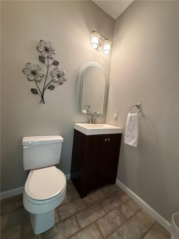 36 Jasmine Cir, North Kingstown, RI 02874 - bathroom featuring vanity, toilet, and baseboards