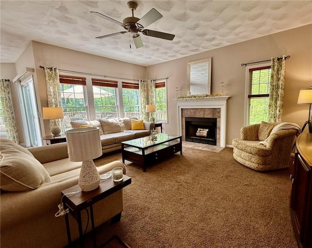 36 Jasmine Cir, North Kingstown, RI 02874 - carpeted living area with ceiling fan and a tiled fireplace