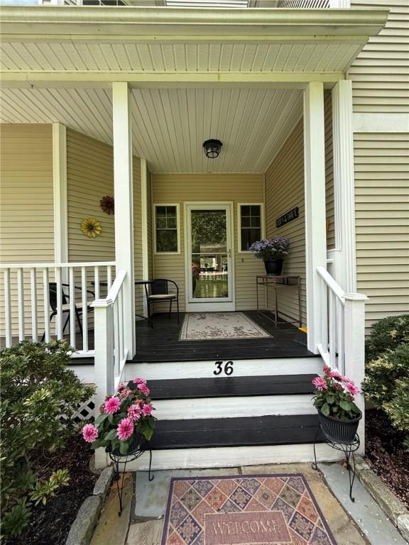 36 Jasmine Cir, North Kingstown, RI 02874 - entrance to property featuring covered porch