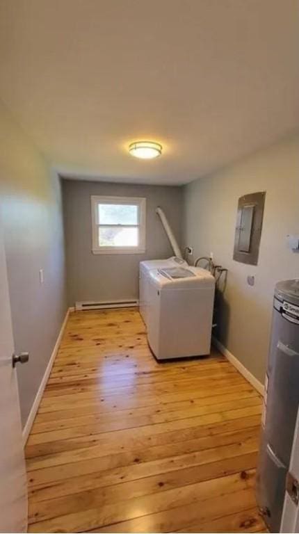 132 Maple Ave, Middletown, RI 02842 - laundry area featuring washer / dryer, baseboard heating, light wood-style flooring, electric panel, and water heater