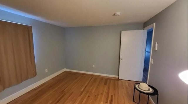 132 Maple Ave, Middletown, RI 02842 - unfurnished room with wood finished floors, baseboards, and a smoke detector