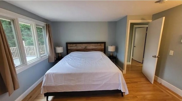 132 Maple Ave, Middletown, RI 02842 - bedroom with baseboards and light wood finished floors