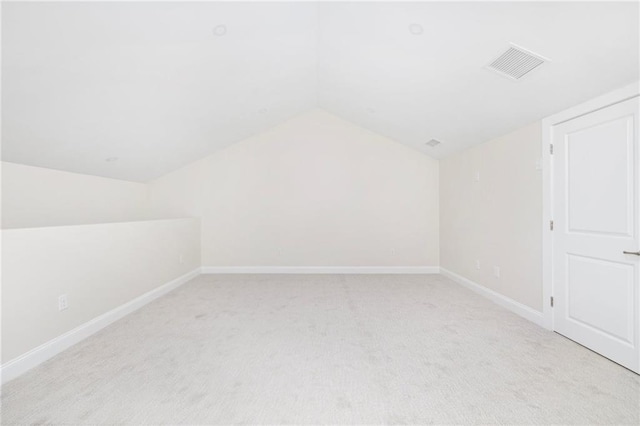 81 W Valley Cir, West Warwick, RI 02893 - additional living space featuring lofted ceiling, light colored carpet, and baseboards