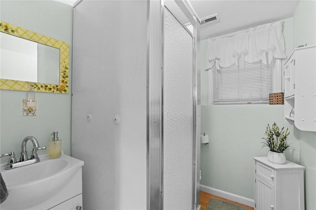 52 Eddy St, North Providence, RI 02911 - bathroom with vanity and wood finished floors