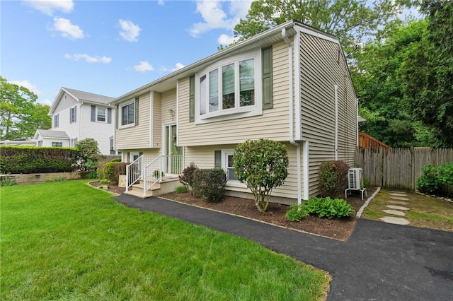52 Eddy St, North Providence, RI 02911 - split foyer home featuring a cooling unit