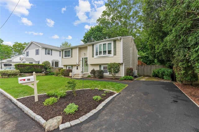 52 Eddy St, North Providence, RI 02911 - bi-level home with asphalt driveway and entry steps