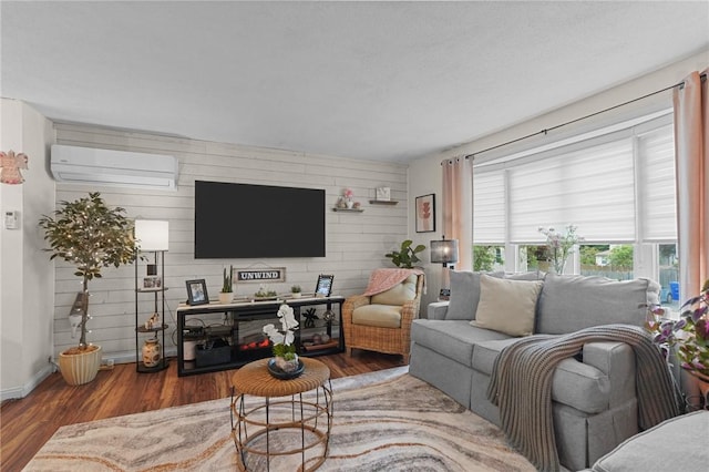 52 Eddy St, North Providence, RI 02911 - living area featuring a wall mounted AC, wood finished floors, baseboards, and wood walls