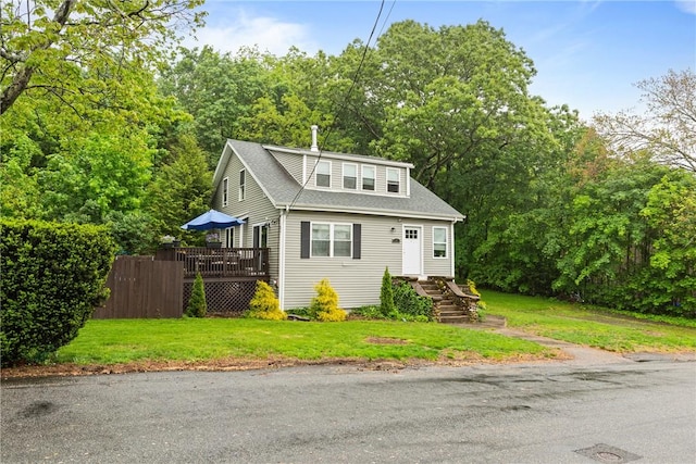 27 Aberdeen St, West Warwick, RI 02893 - view of front of home with a wooden deck, a front lawn, and roof with shingles