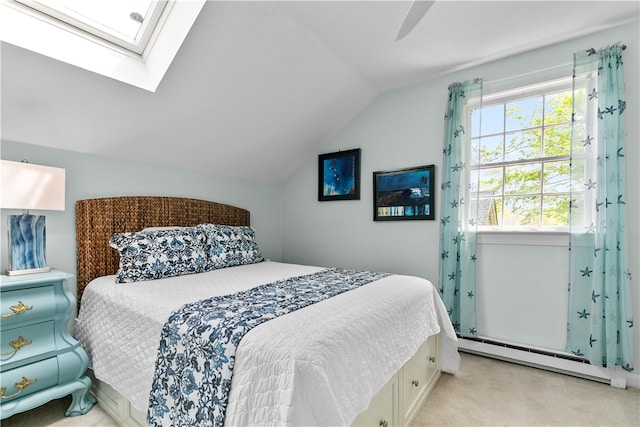 97 Narragansett Ave Unit C4, Newport, RI 02840 - bedroom featuring vaulted ceiling, light colored carpet, a baseboard radiator, a skylight, and ceiling fan