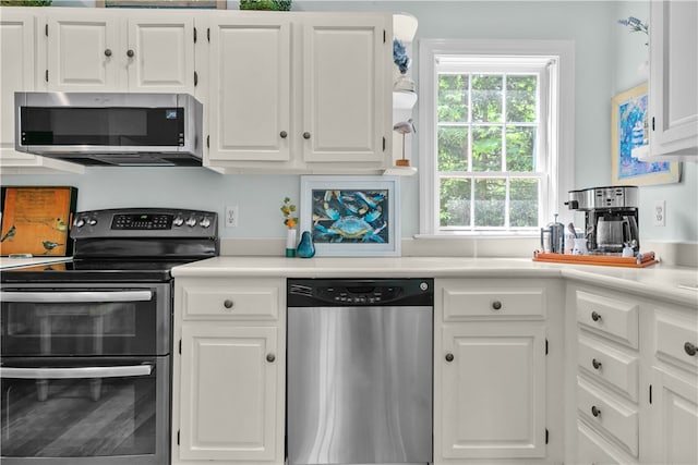 97 Narragansett Ave Unit C4, Newport, RI 02840 - kitchen with stainless steel appliances, light countertops, and white cabinets