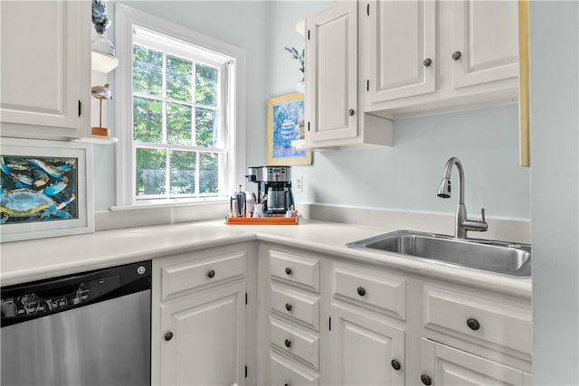 97 Narragansett Ave Unit C4, Newport, RI 02840 - kitchen with stainless steel dishwasher, a sink, white cabinetry, and light countertops