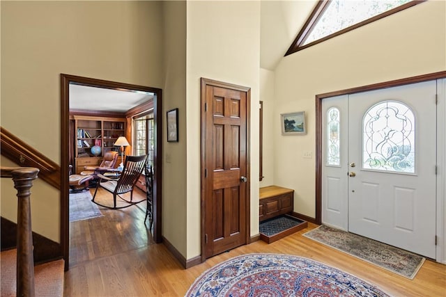 10 Bartlett Rd, Middletown, RI 02842 - foyer with light wood-style floors, high vaulted ceiling, and baseboards