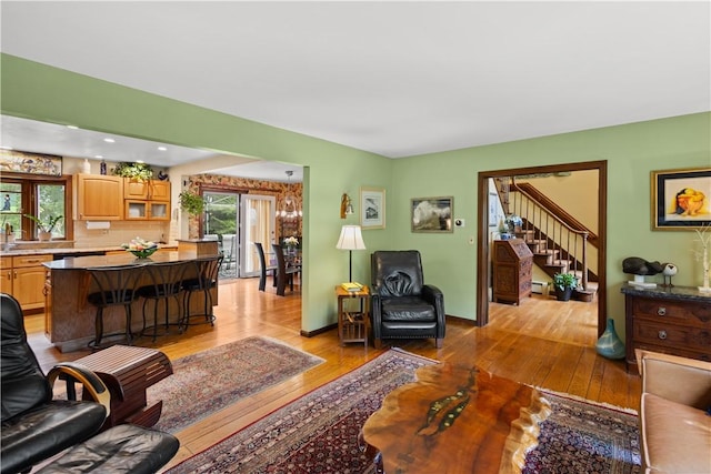 10 Bartlett Rd, Middletown, RI 02842 - living room with light wood-style flooring, stairs, and baseboards