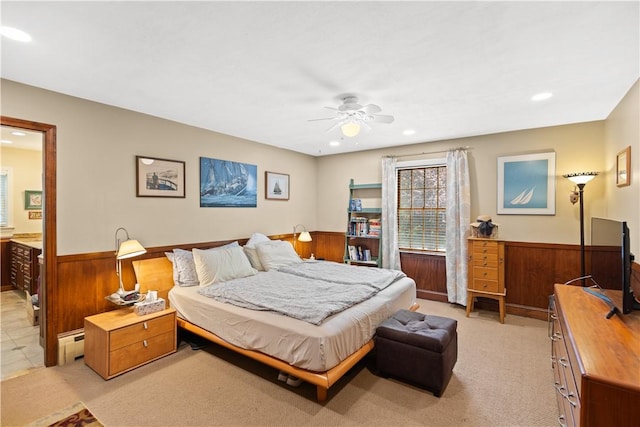 10 Bartlett Rd, Middletown, RI 02842 - bedroom featuring a baseboard heating unit, a wainscoted wall, recessed lighting, a ceiling fan, and light colored carpet