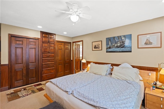 10 Bartlett Rd, Middletown, RI 02842 - bedroom with wainscoting, recessed lighting, ceiling fan, carpet flooring, and wood walls