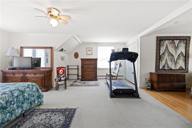 10 Bartlett Rd, Middletown, RI 02842 - bedroom with carpet floors, a baseboard heating unit, and a ceiling fan