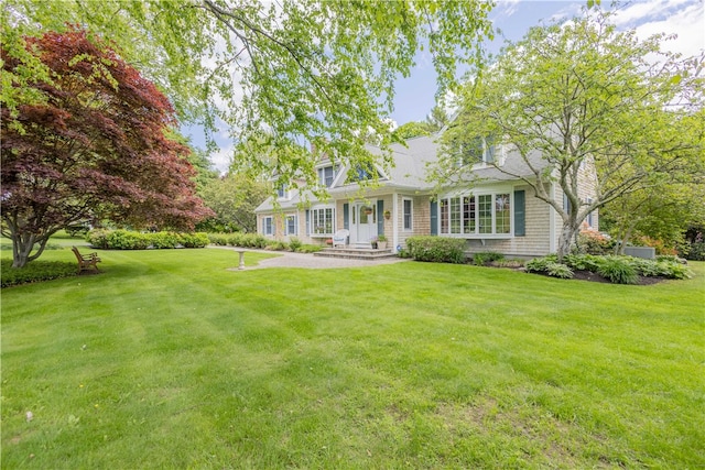 10 Bartlett Rd, Middletown, RI 02842 - cape cod-style house with a front lawn