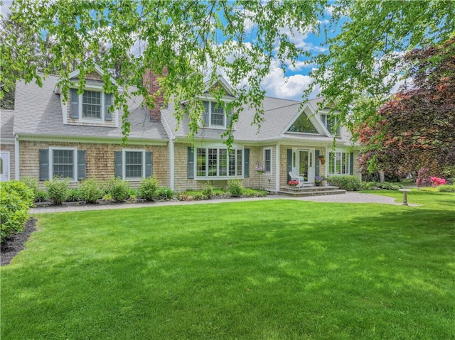 10 Bartlett Rd, Middletown, RI 02842 - view of front of property featuring a front lawn and a shingled roof