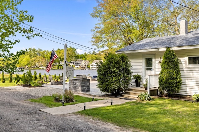 250 Shippee Plat Rd, Coventry, RI 02816 - exterior space with a lawn, a shingled roof, and a chimney