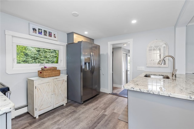 250 Shippee Plat Rd, Coventry, RI 02816 - kitchen featuring stainless steel fridge with ice dispenser, a sink, light wood-style floors, a baseboard radiator, and recessed lighting