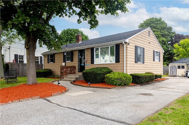 71 Julian St, Pawtucket, RI 02861 - view of front facade with a chimney and an outbuilding