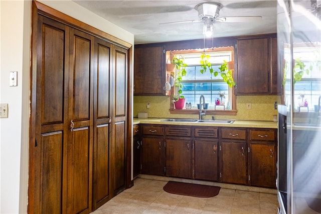 71 Julian St, Pawtucket, RI 02861 - kitchen with a sink, stainless steel fridge, a ceiling fan, and light countertops