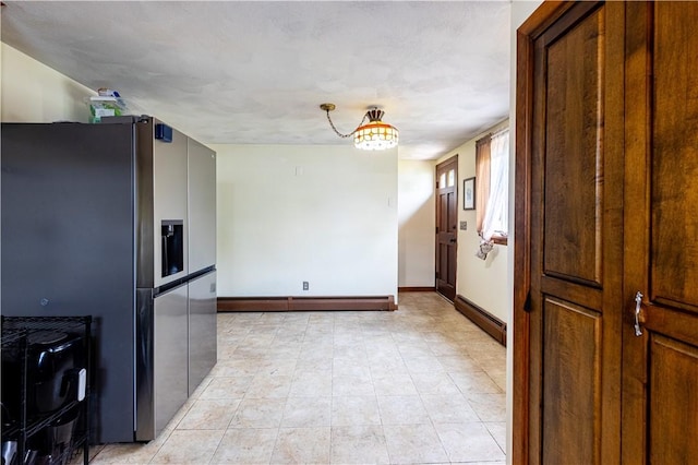 71 Julian St, Pawtucket, RI 02861 - kitchen featuring stainless steel fridge, baseboards, baseboard heating, and a baseboard radiator