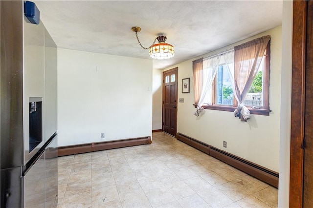 71 Julian St, Pawtucket, RI 02861 - spare room with a baseboard heating unit, baseboards, and light tile patterned floors