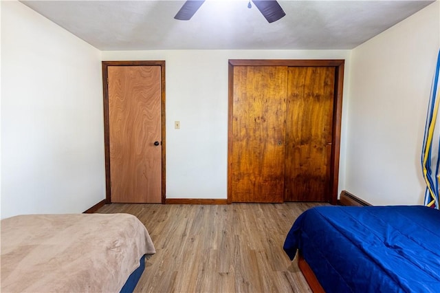 71 Julian St, Pawtucket, RI 02861 - bedroom featuring baseboard heating, wood finished floors, baseboards, and a ceiling fan