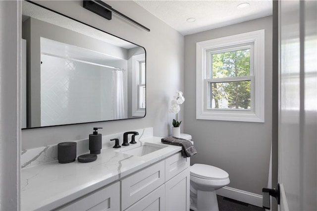 99 Scranton Ave, Warwick, RI 02888 - bathroom with toilet, vanity, a shower with curtain, and baseboards
