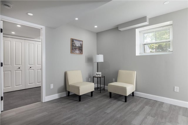 99 Scranton Ave, Warwick, RI 02888 - living area with wood finished floors, baseboards, and recessed lighting
