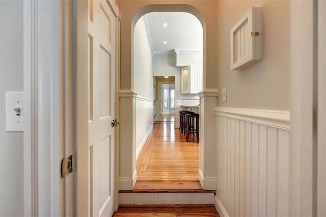 368 Thayer St Unit 2, Providence, RI 02906 - hall featuring light wood finished floors, a wainscoted wall, arched walkways, a decorative wall, and crown molding