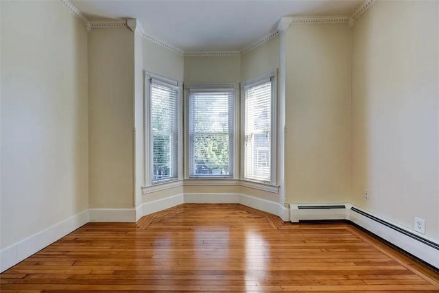 368 Thayer St Unit 2, Providence, RI 02906 - empty room with hardwood / wood-style floors, plenty of natural light, crown molding, baseboards, and a baseboard radiator