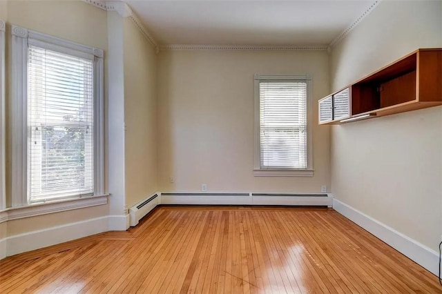 368 Thayer St Unit 2, Providence, RI 02906 - empty room with hardwood / wood-style flooring, baseboards, a baseboard heating unit, and crown molding