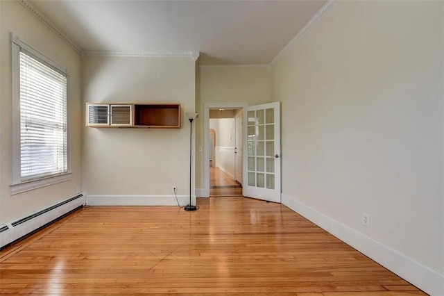 368 Thayer St Unit 2, Providence, RI 02906 - unfurnished room with crown molding, light wood-style flooring, a baseboard radiator, and baseboards