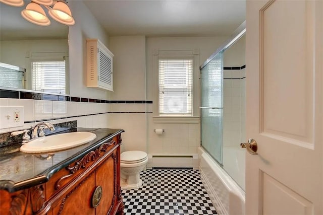368 Thayer St Unit 2, Providence, RI 02906 - full bath featuring baseboard heating, tile patterned floors, tile walls, toilet, and vanity