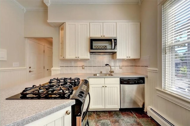 368 Thayer St Unit 2, Providence, RI 02906 - kitchen featuring stainless steel appliances, a baseboard radiator, a sink, light countertops, and backsplash