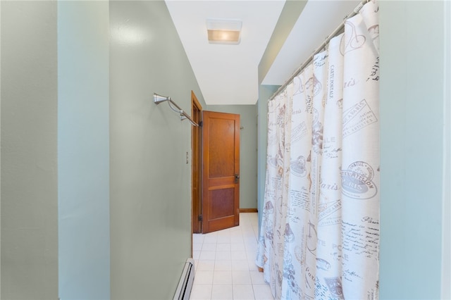 34 Bates Ave, Coventry, RI 02816 - hall featuring light tile patterned floors and a baseboard heating unit