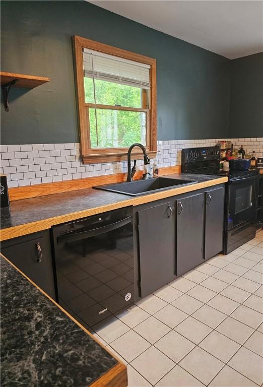 34 Bates Ave, Coventry, RI 02816 - kitchen featuring black appliances, a sink, tasteful backsplash, light tile patterned floors, and wooden counters