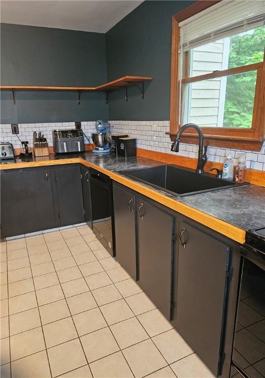 34 Bates Ave, Coventry, RI 02816 - kitchen with open shelves, a sink, tasteful backsplash, and dark countertops