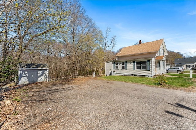34 Bates Ave, Coventry, RI 02816 - view of property exterior with a chimney, roof with shingles, and a lawn