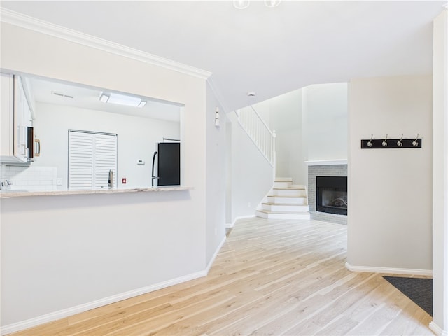 626 Smithfield Rd Unit 909, North Providence, RI 02904 - corridor with light wood-style floors, baseboards, stairs, crown molding, and a sink