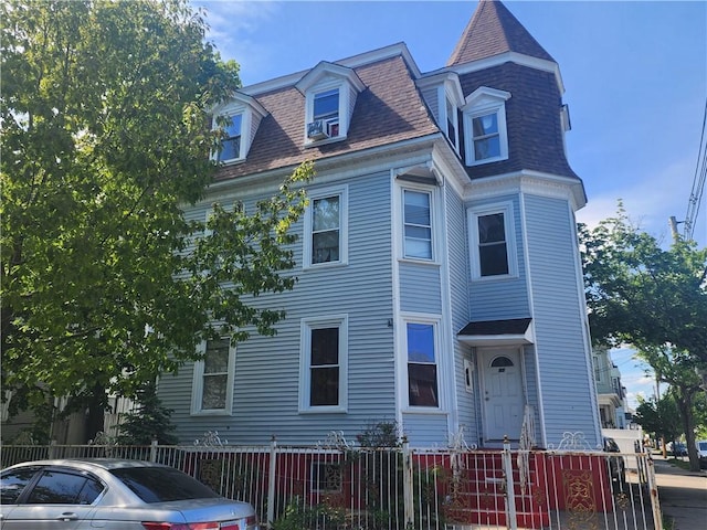 95 Congress Ave, Providence, RI 02907 - view of front facade with a fenced front yard and a shingled roof