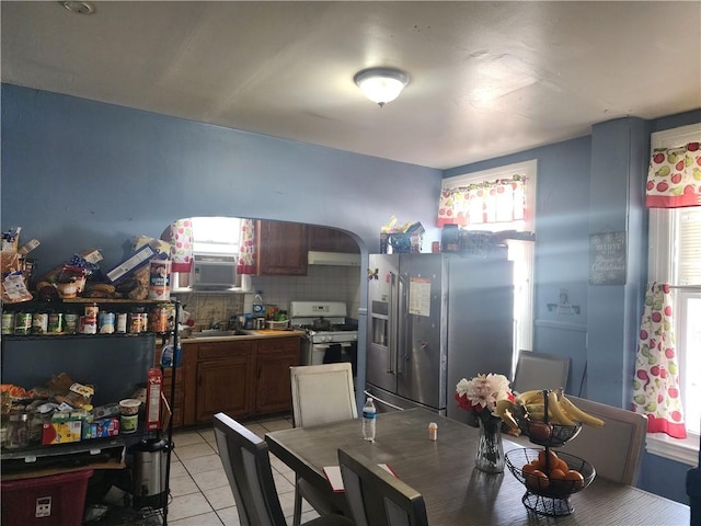 95 Congress Ave, Providence, RI 02907 - dining area with light tile patterned floors, arched walkways, and cooling unit