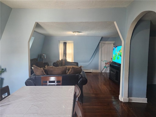 95 Congress Ave, Providence, RI 02907 - dining room with wood finished floors, a textured ceiling, a baseboard radiator, and baseboards