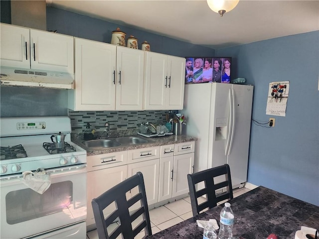 95 Congress Ave, Providence, RI 02907 - kitchen with under cabinet range hood, white appliances, a sink, decorative backsplash, and white cabinets