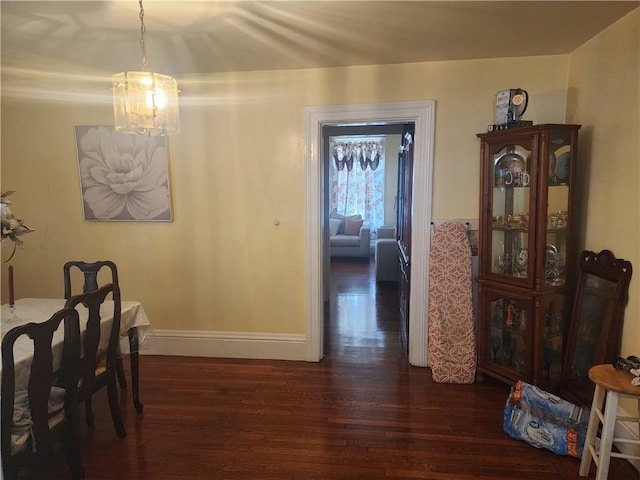 95 Congress Ave, Providence, RI 02907 - dining area with dark wood finished floors, a chandelier, and baseboards